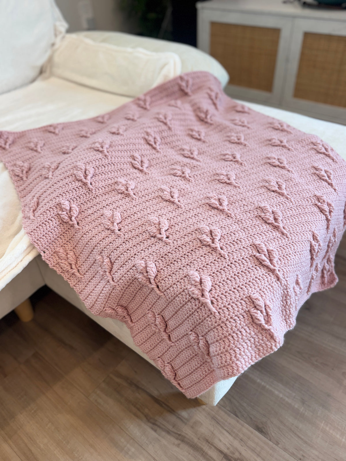 Blush pink heirloom crochet blanket with raised petal stitch, handmade by The Crochet Corral in Florida