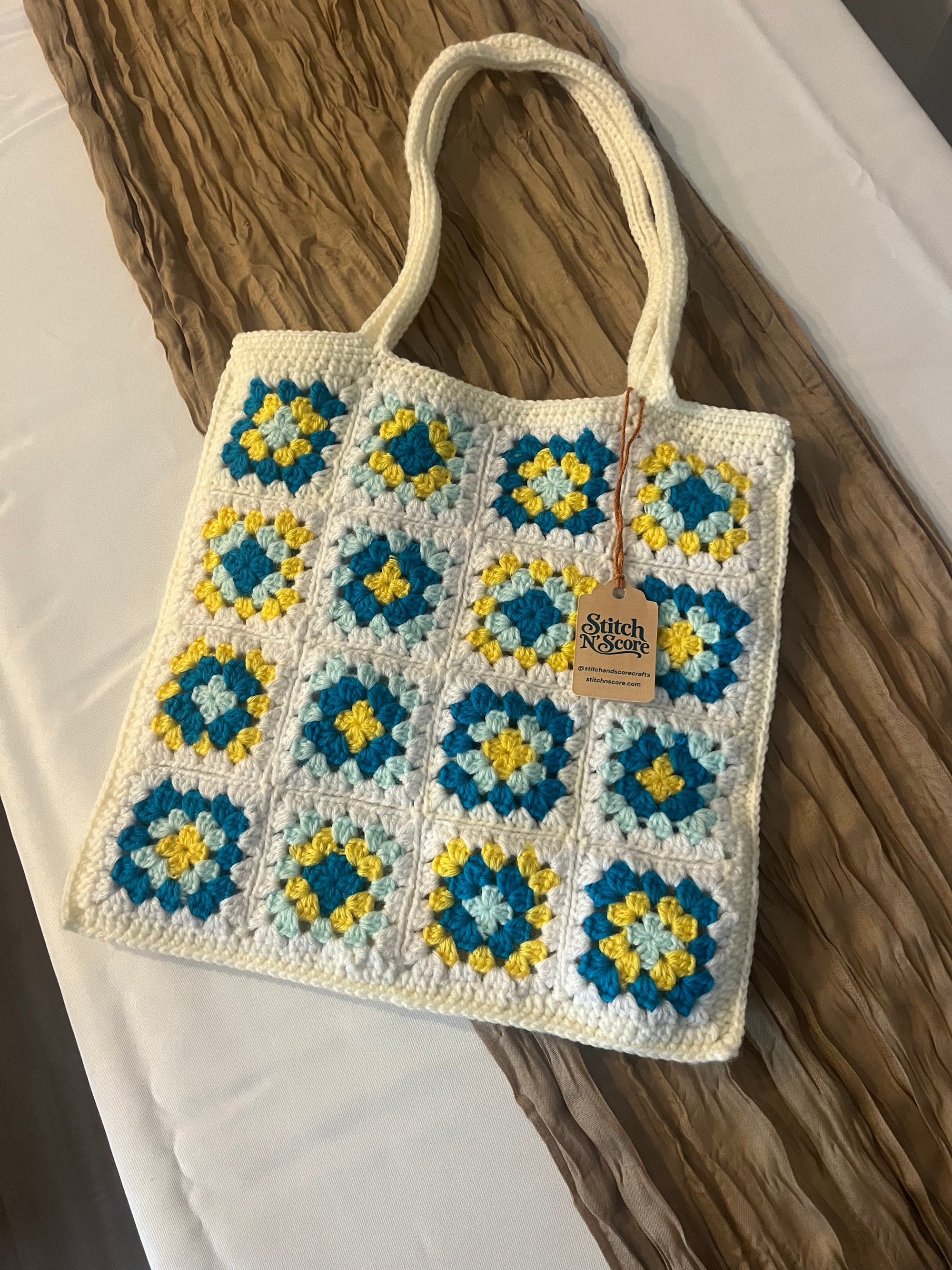 Granny square crochet tote bag in blue, yellow and cream