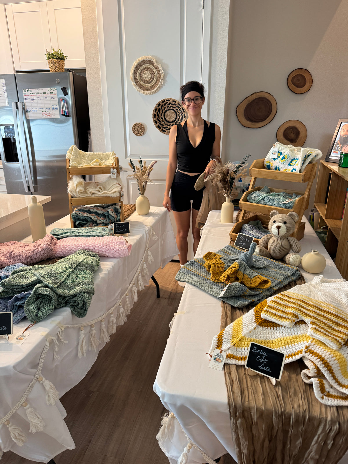 Lydia, the maker behind Stitch N' Score, with her handmade crochet blankets and baby sets